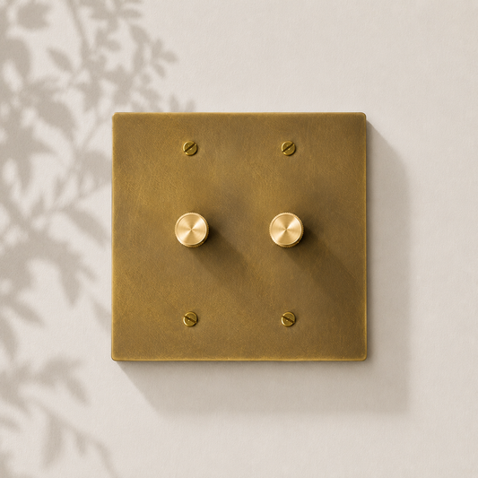 Double solid brass dimmer switch with a brushed finish.