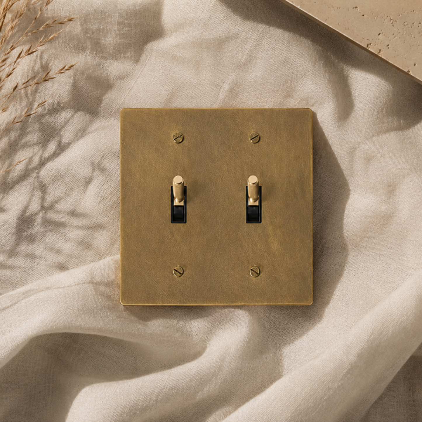Solid brass double toggle switch installed in a thoughtfully designed home.