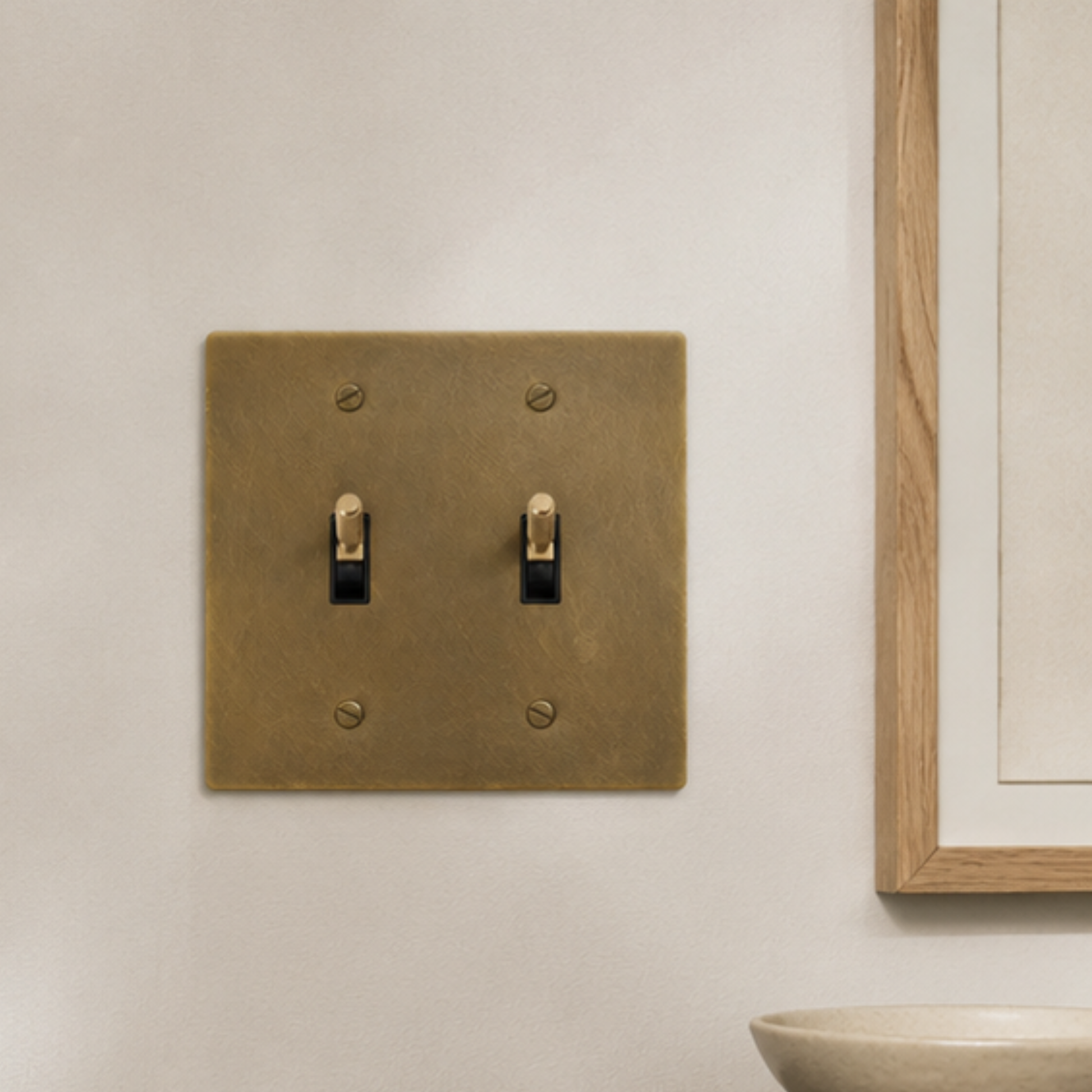 Architectural double toggle light switch crafted from solid brass.