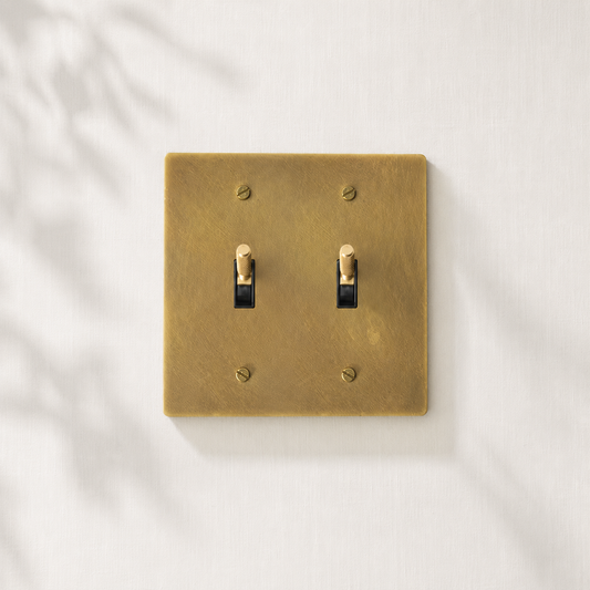 Double solid brass toggle light switch with a brushed finish for modern interiors.