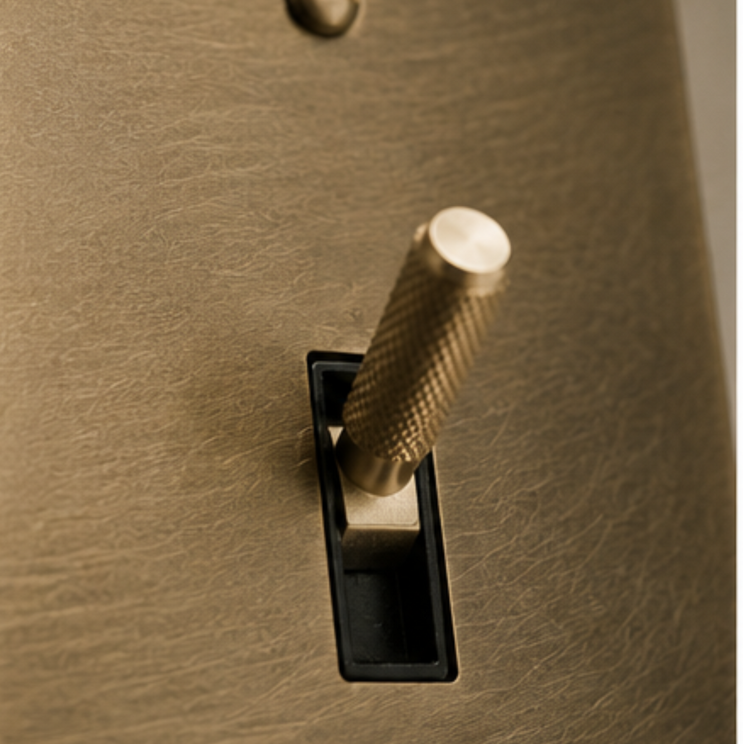 Knurled solid brass toggle switch showcasing precision-machined craftsmanship.