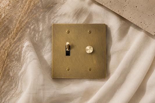 Close-up of the solid brass dimmer knob and toggle switch.