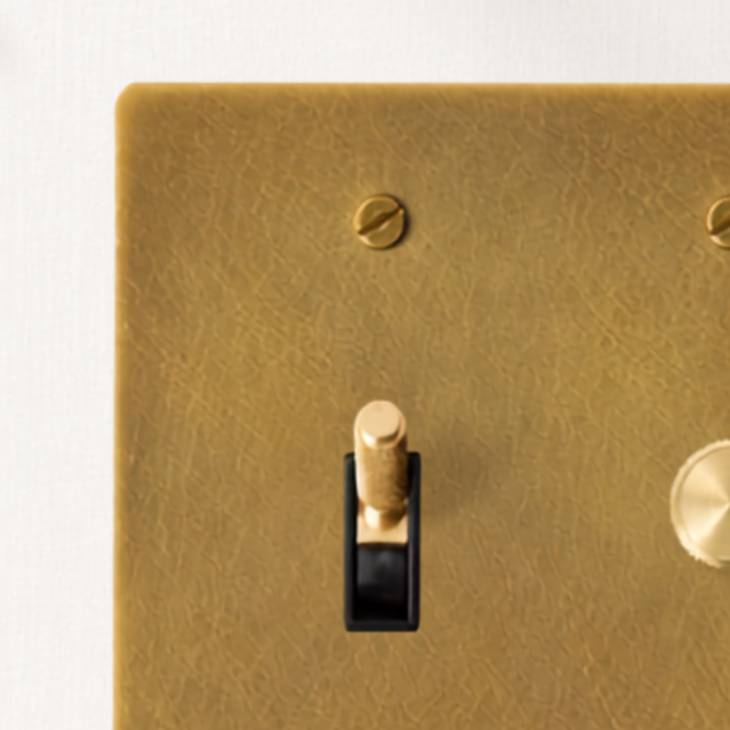 Close-up of the solid brass dimmer knob and toggle switch.