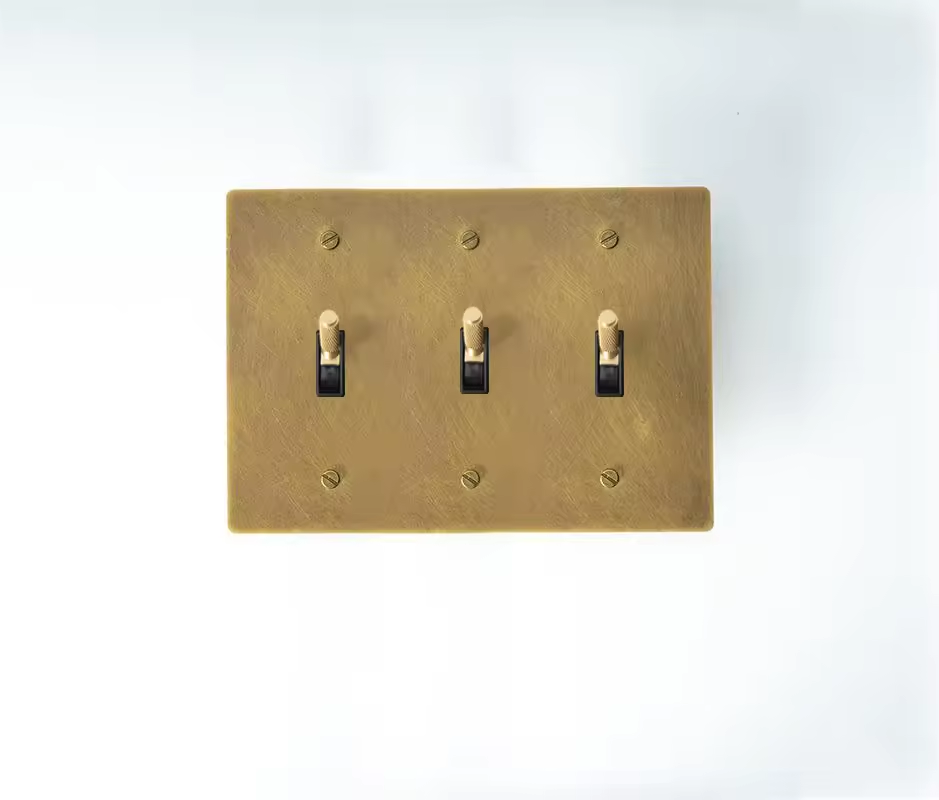 Architectural triple toggle switch for timeless interiors.